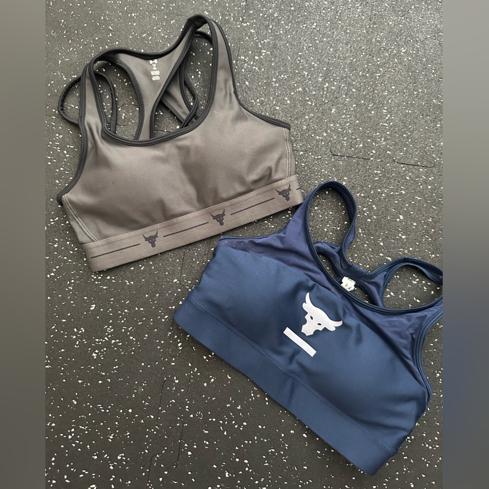 Two Under Armour sports bras. Size small
